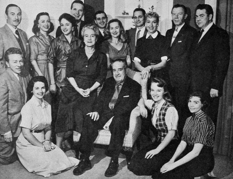 Anne Whitfield and other radio casts of the "One Man's Family" are smiling all together