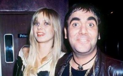 Annette Walter-Lax wearing black and white dress and Keith Moon wearing black leather jacket, black t-shirt and necklace