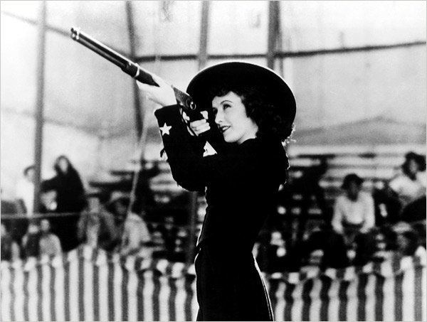 Annie Oakley (film) movie scenes Annie enters into a sharpshooting contest against Walker but louses up the winning shot because he Walker was just too pretty When Walker and Oakley 