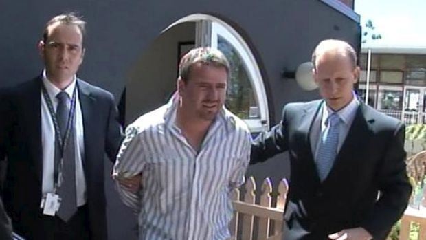 Anthony Perish being arrested at McMahon's Point in 2009