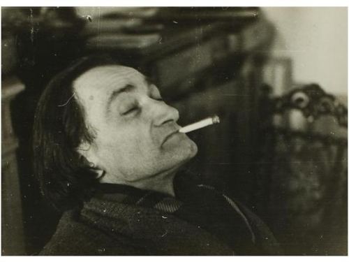 Antonin Artaud smoking while his eyes closed