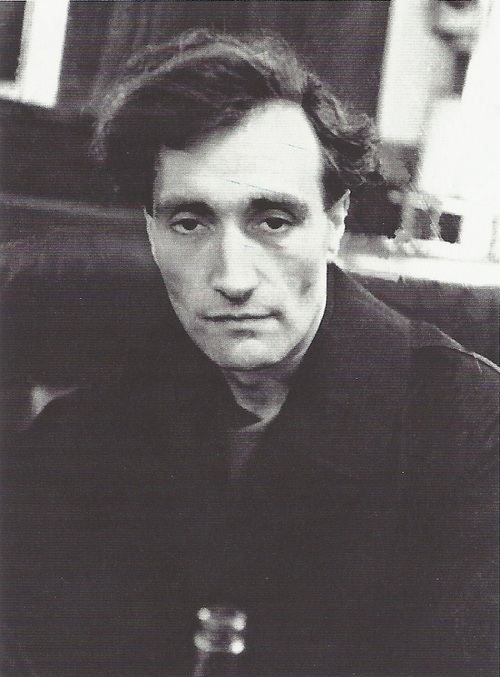 Antonin Artaud's serious face while wearing black long sleeves