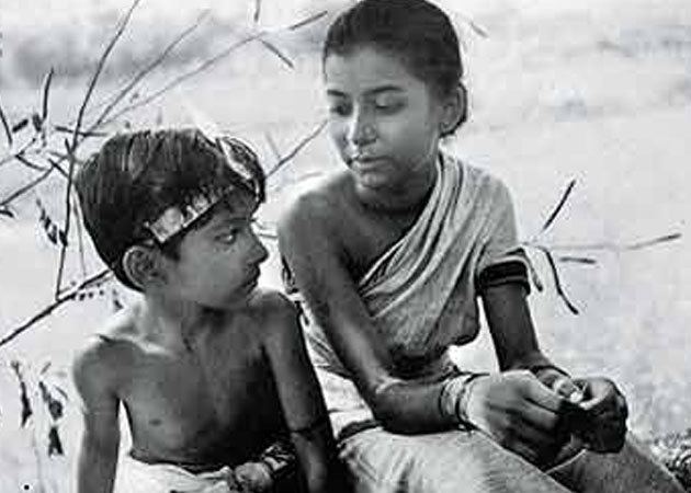 Apur Panchali movie scenes  with a Doodle depicting a famous scene of the young Durga and Apu running through fields from possibly his most famous film Pather Panchali 