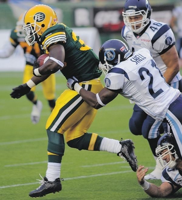 Arkee Whitlock Eskimos running back Arkee Whitlock is tackled by LinJ Shell of the