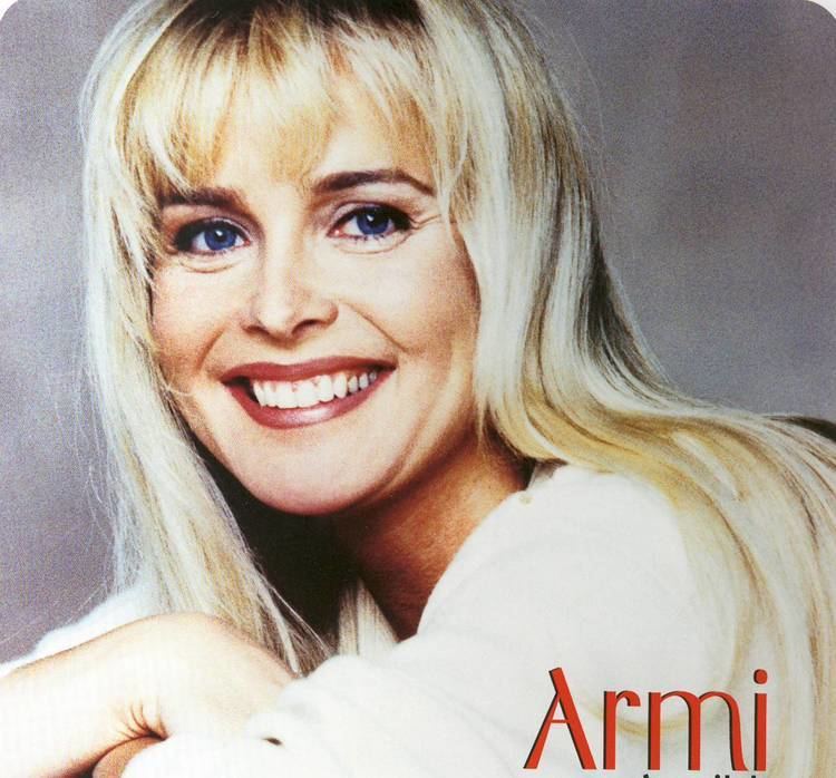 Armi Aavikko smiling and wearing a white blouse