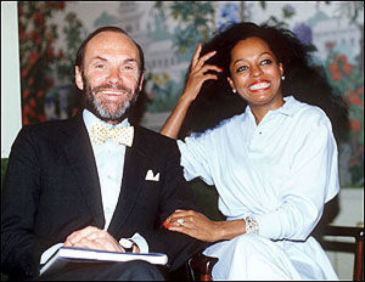 Arne Naess, Jr. smiling and wearing a black coat, white long sleeves, and yellow bow tie while Diana Ross wearing a white dress