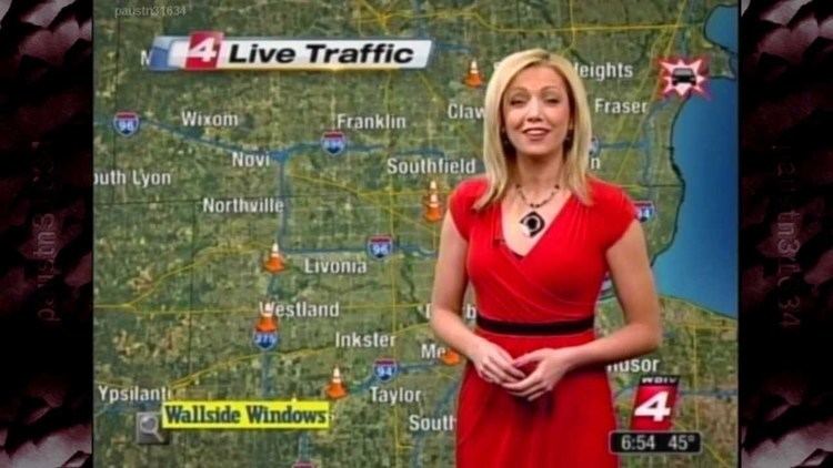 Ashlee Baracy as morning traffic reporter while wearing a red dress, black belt, and necklace