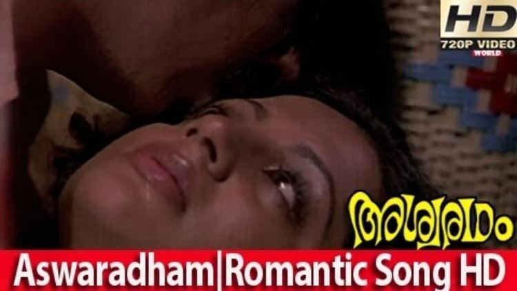 Srividya and Raveendran in an intimate scene from the 1980 Indian Malayalam film, Ashwaradham