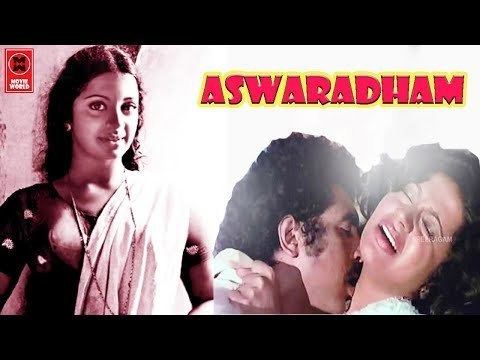 On the left, Srividya smiling and wearing a blouse and dupatta while on the right, Raveendran kissing Srividya's neck in a scene from the 1980 film, Ashwaradham