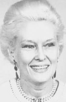 Athalia Ponsell Lindsley smiling, with white hair, wearing earrings, and a pearl necklace.