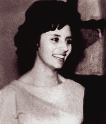 Augusta la Torre smiling during her wedding day while wearing a dress