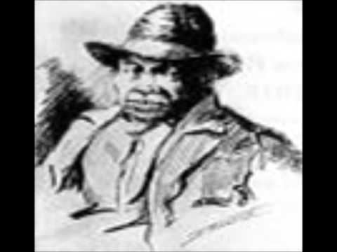 Portrait of Augustus Jackson with a serious face while wearing a hat, coat, and long sleeve
