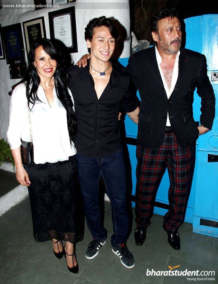 Ayesha Dutt in her gorgeous smile while wearing white long sleeves and black long skirt with Tiger Shroff in his black long sleeves and Jackie Shroff wearing black coat, white long sleeves and checkered pants