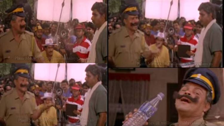 Zainuddin talking to Innocent while wearing a gray t-shirt and Biju Menon directing the scene in the 1996 film, Azhakiya Ravanan