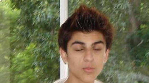 Young Aziz Shavershian with closed eyes.