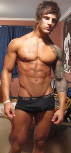 Aziz Shavershian with a serious face and wearing gray underwear.