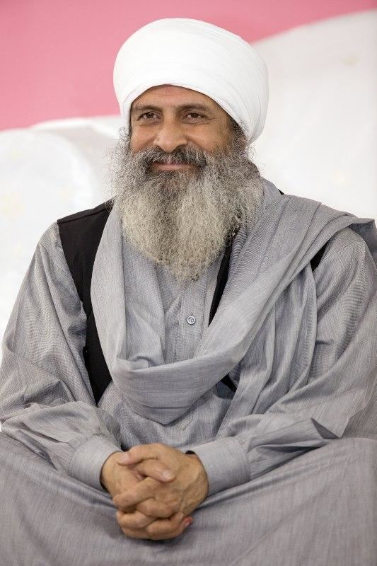 Baljit Singh (Sant Mat) wearing a black and gray long-sleeved shirt