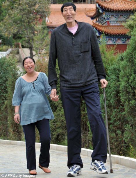 Bao Xishun First pictures of the world39s tallest dad cradling his