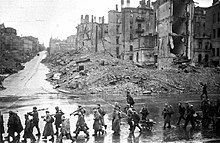 The Soviet infantry marching through the main street Kreschatik in ruins after Kiev's liberation from Nazis.