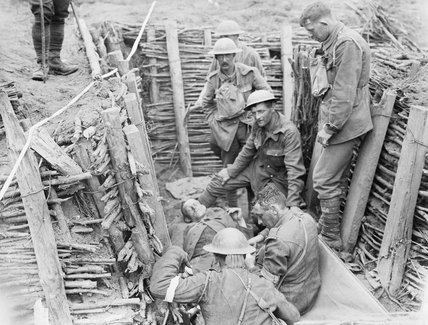 Battle of Pilckem Ridge Irish Guardsmen attending to a wounded German during the Battle of