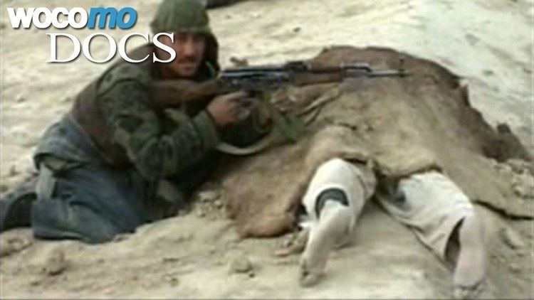 Soldier and a dead body during the Battle of Qala-i-Jangi