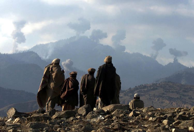 Smoke coming out of the Tora Bora mountains brought by the aerial bombardment being observed by Afghans.