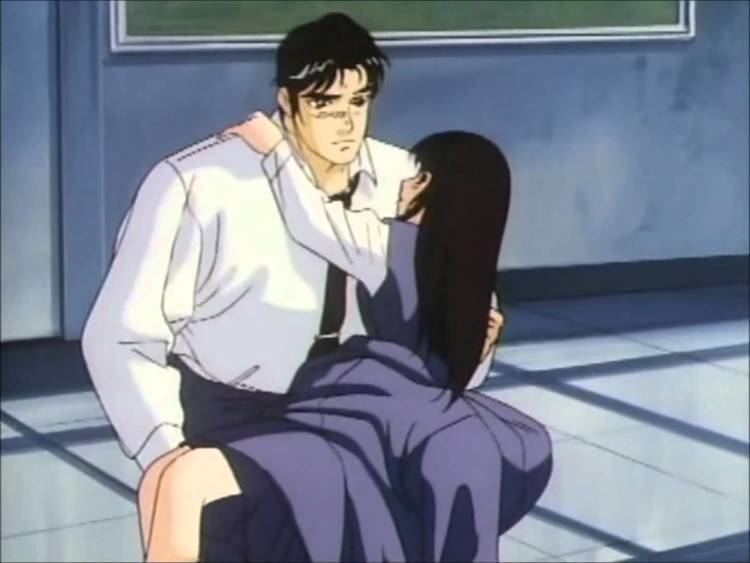 A man was looking while carrying a girl in a corridor, a clip from a 1986 animation movie “Battle Royal High School”, the man has black hair wearing a white polo long sleeve with a black necktie and black pants, while the girl has long black hair wearing a white long sleeve under a blue dress