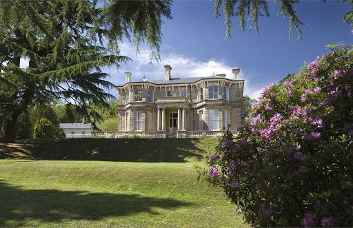 The Beechwood House, Newport is a small mansion in simple Italianate Classical style surrounded by trees and ornamentals.