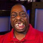 Beetlejuice with a wacky face and wearing a red polo shirt.