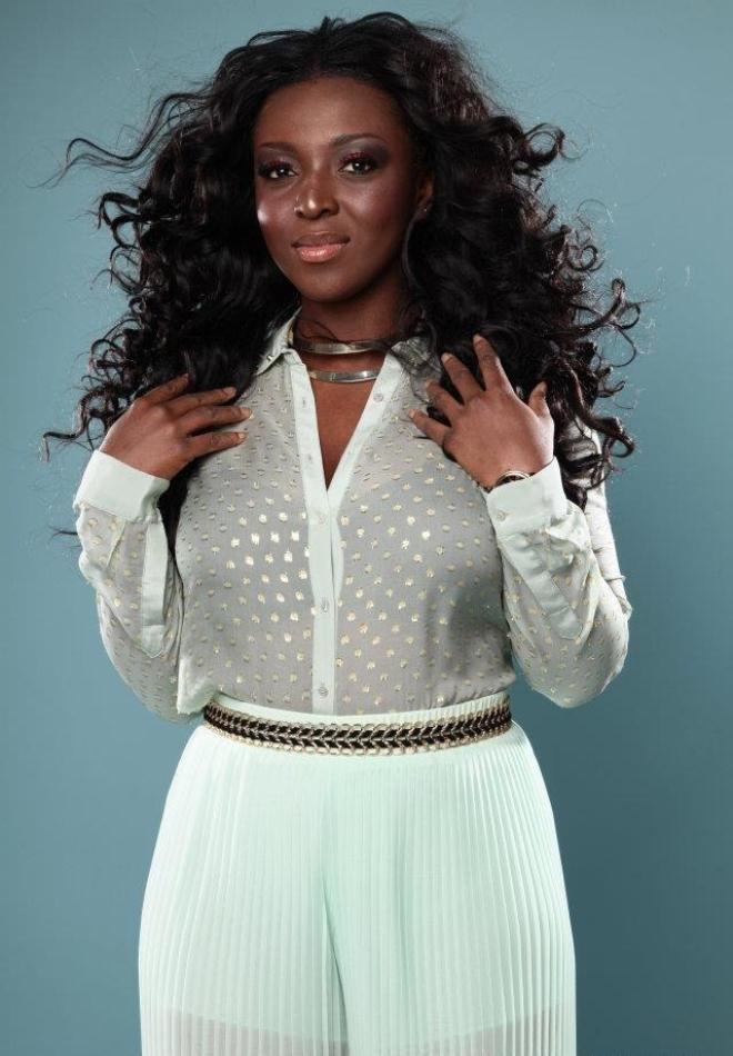 Bella Enahoro wearing a white long sleeves and white pants