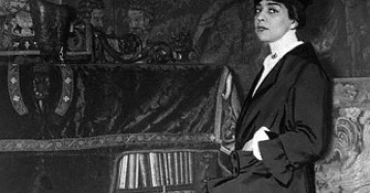 Belle da Costa Greene sitting on the couch