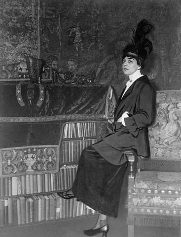 Belle da Costa Greene sitting on the couch wearing sleeve