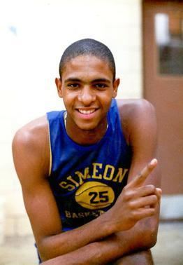 Smiling Ben Wilson wearing a blue basketball jersey