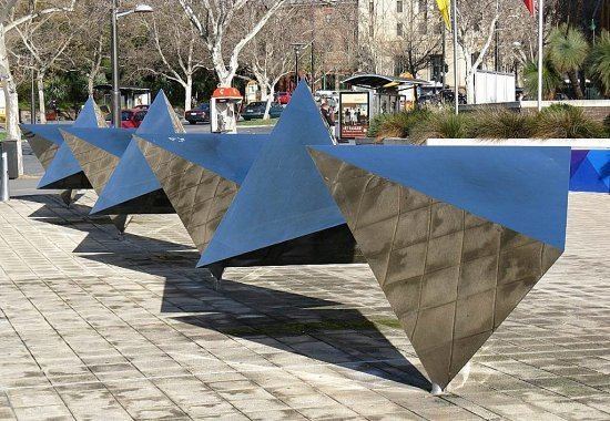 Bert Flugelman Tetrahedronquot a Bert Flugelman sculpture in front of the