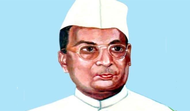 Bhagwati Charan Verma's portrait while wearing a white cap, eyeglasses, and white long sleeves
