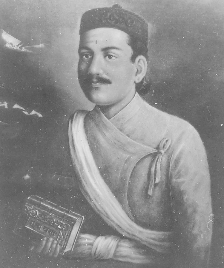 Bhanubhakta Acharya holding a book in black and white