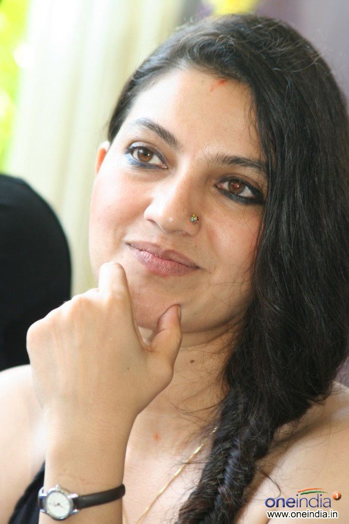 Bhavana Ramanna with a nose piercing and wearing a black watch.