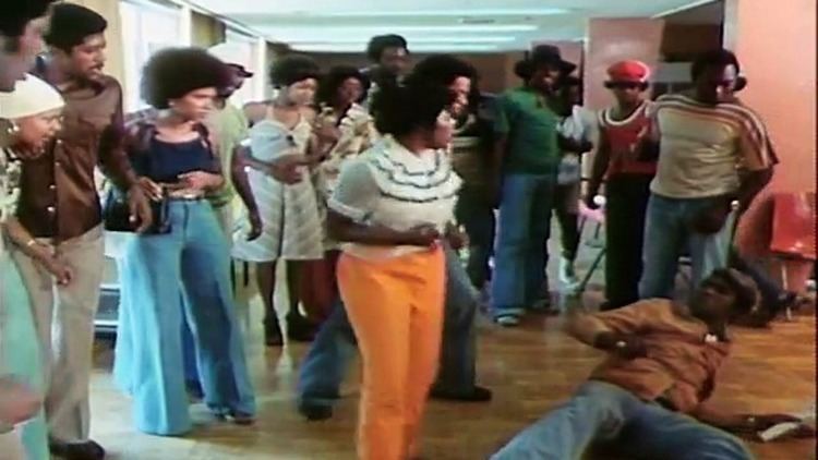 A group of black people in a scene from the 1974 Blaxploitation film written and directed by Jamaa Fanaka, Black Sister's Revenge.