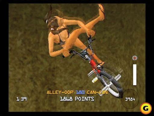 BMX XXX game, on dirt ground a girl is riding a red bike, wearing a black  two piece swimsuit and black flip flops.  At the bottom from left, is a time countdown, and in the middle is the trick name with points given “ALLEY-OOP 180 CAN-CAN-1868 POINTS” At the right is a digital score counter and a life bar.