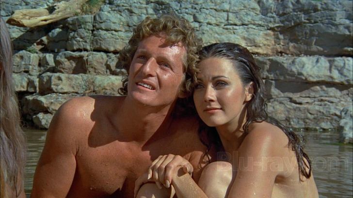 Marjoe Gortner and Lynda Carter are looking afar while they are at the lake in a scene from the 1976 film, Bobbie Jo and the Outlaw