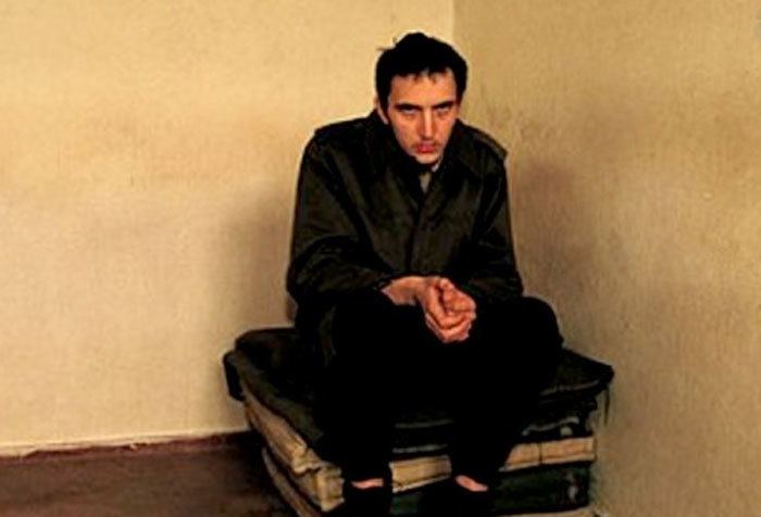 Borislav Herak's serious face while wearing a black jacket and black pants