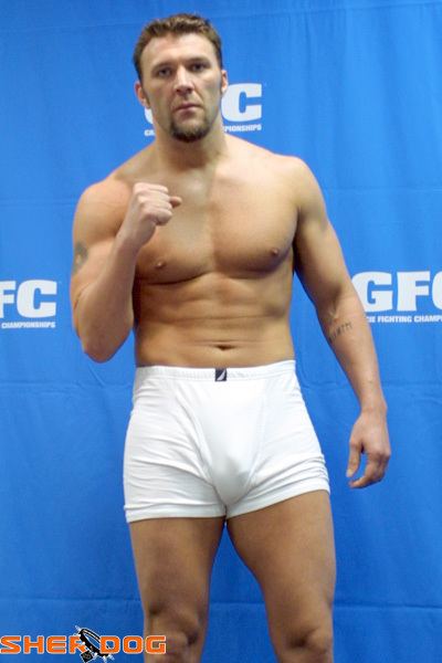 Branden Lee Hinkle showing his fist while wearing white boxer shorts