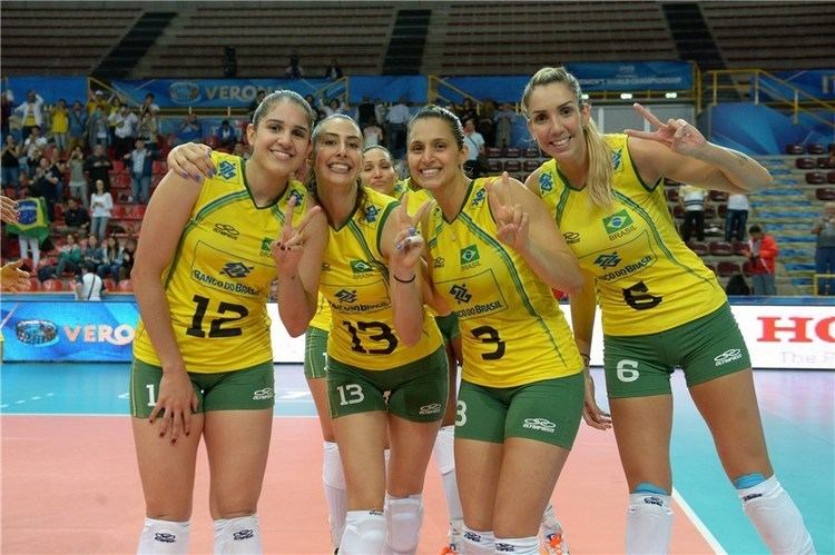 Brazil women's national volleyball team smiling together while wearing their volleyball jersey
