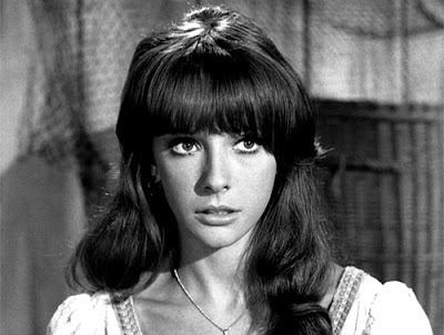 Brenda Scott as Carla with wavy hair and bangs in a movie scene from the 1964 film The Fugitive