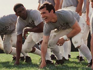 Sean Maher as Brian Picollo and Mekhi Pifer as Gale Sayers doing a ground training from  the movie "Brian's Song" in 1971