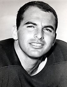 Brian Piccolo smiling and looking afar while wearing a jersey