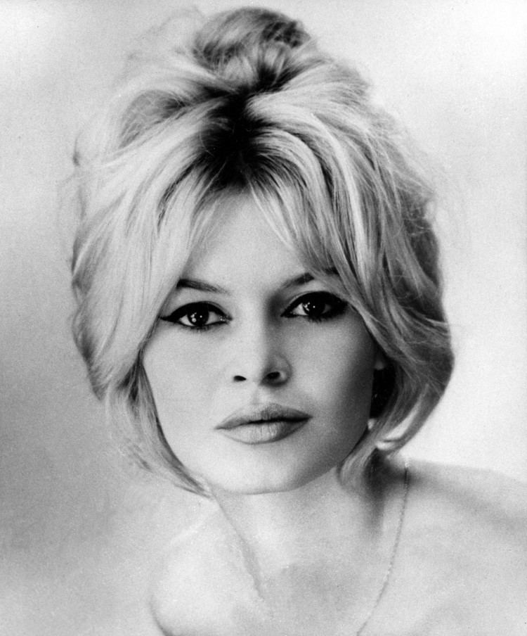 Brigitte Bardot with tied up hair while wearing a necklace