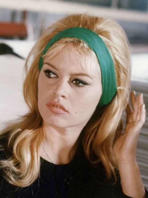 Brigitte Bardot wearing a green headband and black blouse