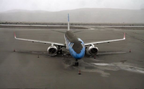 A plane dusted in volcanic ash sits grounded at the San Carlos de Bariloche airport, Southern Argentina.