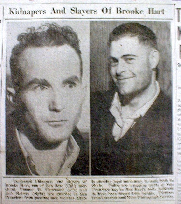 A newspaper featuring Thomas Thurmond with a serious face and John Holmes with a tight-lipped smile, the kidnapers and slayers of Brooke Hart.